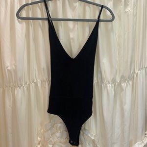 Forever 21 black bodysuit. Adjustable Spaghetti straps. Women’s size small.